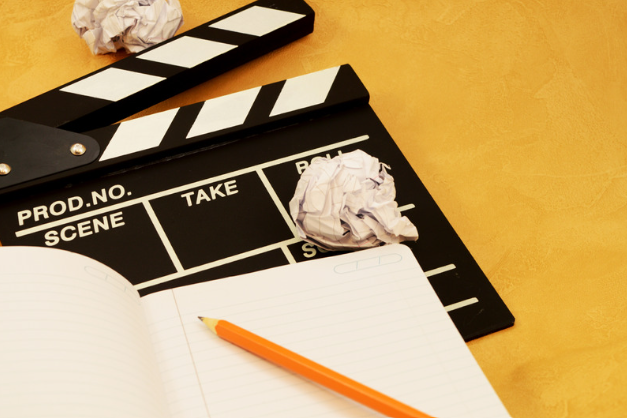 image of film clapper board and notebook